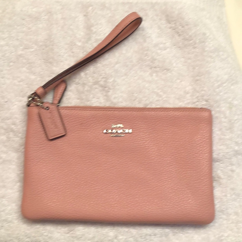 Coach wristlet in soft pink pebbled leather. EUC. one small spot in lining (